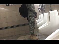 Soldier hardon in public bathroom.